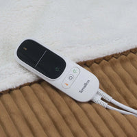 Närbild på Terraillon Koomys digitala fjärrkontroll med knappar för på/av, temperatur och timer