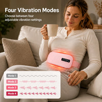 Kvinna använder rosa värmebälte med fyra justerbara vibrationslägen.